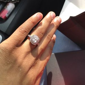 A customized diamond and white sapphire ring.